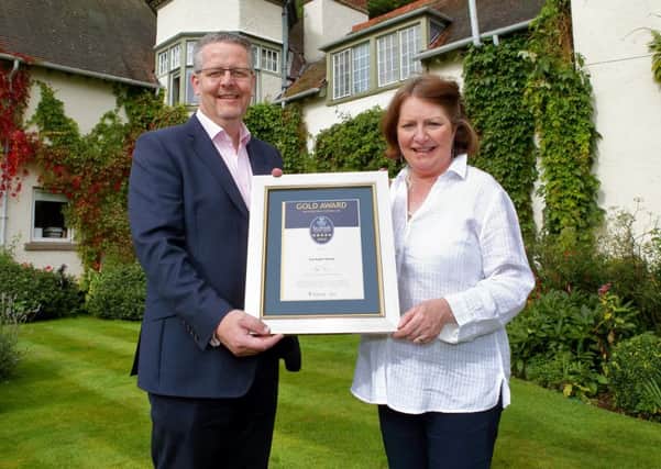 VisitScotland regional director Doug Wilson with Sheila Robson, owner of Fauhope Country House B&B.