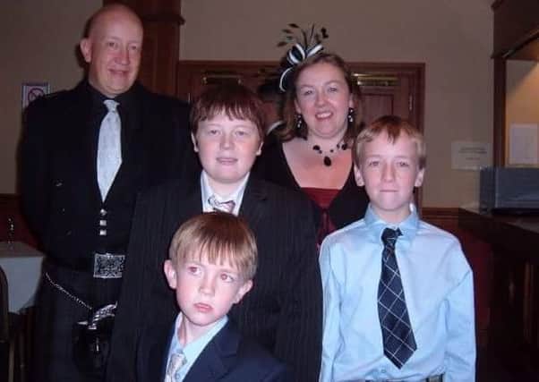 The late Anthony Mundell, standing centre, with dad Keith, mum Ros and younger brothers Chandler and Zack.