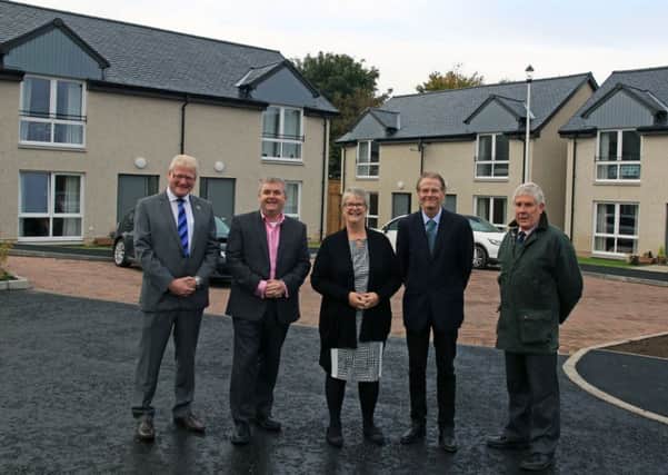 At Croft Field Court are, from left, councillors Stuart Marshall and David Parker and Frances Renton, Cruden Homes construction director Billy Murphy and councillor Ron Smith.