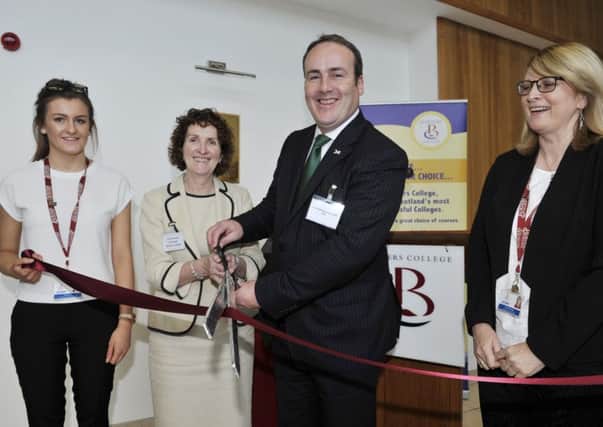 Liz McIntyre, principal at Borders College, cuts the ribbon with MSP Paul Wheelhouse to open its new business centre in Hawick.