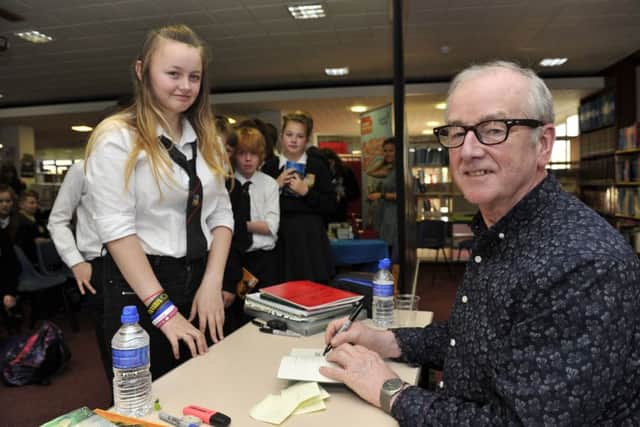 Pupils line up to get their books signed by teen author David Almond at Galashiels Academy in the Scottish Borders