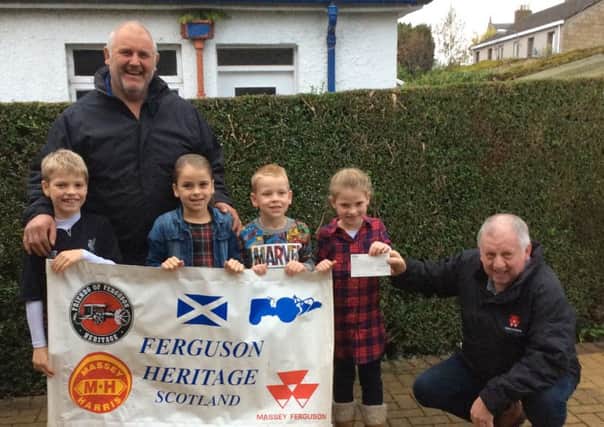 Pictured above are Ians grandchildren receiving the cheque given by Rob Gourlay (event co-ordinater). They are, left to right, George Robertson, Finlay Clark, Mirren Clark, Lucas Clark, Robyn Clark and Rob Gourlay.