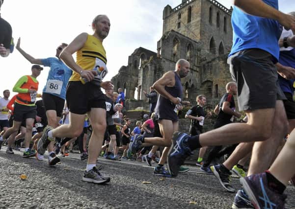 The running festival 10K and half marathon passes Jedburgh Abbey (picture by Stuart Cobley)