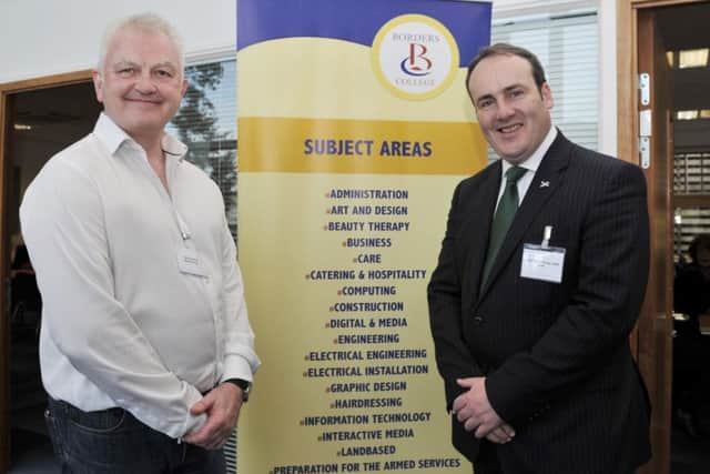Spark Energy's John Hawkins and MSP Paul Wheelhouse attending the opening of the new business centre.