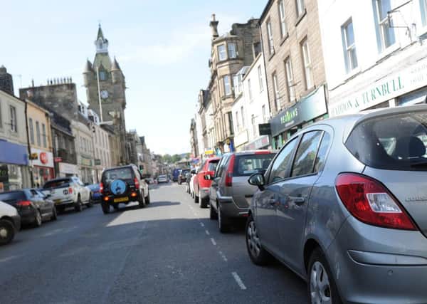 Finding a parking space is difficult along Hawick High Street.