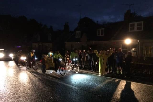 Team Rickshaw are cheered on their way at Camptown.