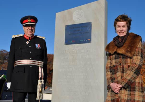 Lord-lieutenant Gerald Maitland-Carew and Michelle de Bruin at the stone's unveiling at Tweedbank railway station.