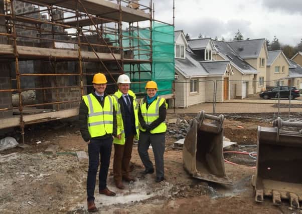 John Lamont MSP, left, and Scottish Conservatives leader Ruth Davidson MSP, right, chat with the managing director of M&J Ballantyne, Michael Ballantyne, at the company's East Broomlands building site.