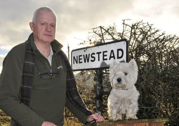 John Brown with his Terrier Treacle at the poo box he made as the council refused to install one near a popular walk near his home in Newstead.