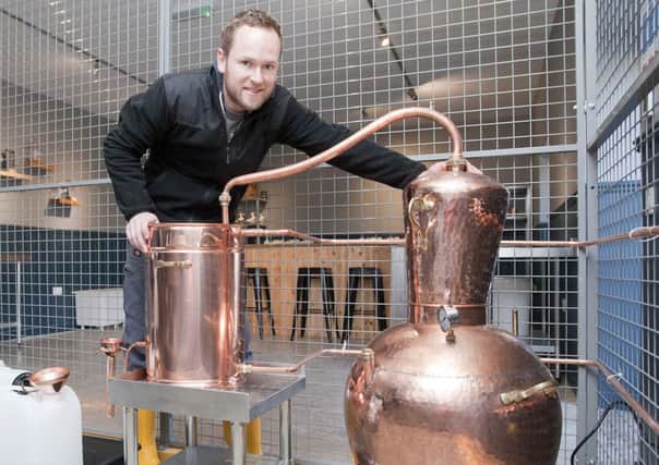 Tom Graham, brewer at Born in the Borders brewery, meets his new neighbour, The Lilliard Gin still.