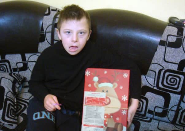 A ten-year-old boy from central Romania has become the two-millionth person to receive a gift box from Blythswood Cares Shoe Box Appeal.