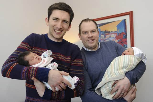Johnathan Morton with baby Flora and Kevin Brown with baby Thea