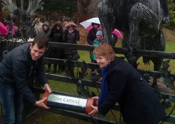 Showjumper Scott Brash helps Bonnie Peebles co-ordinator Avril Murray bury a time capsule in front of the new sculpture celebrating Scott's Olympic team gold in 2012 as well as his more recent successes.