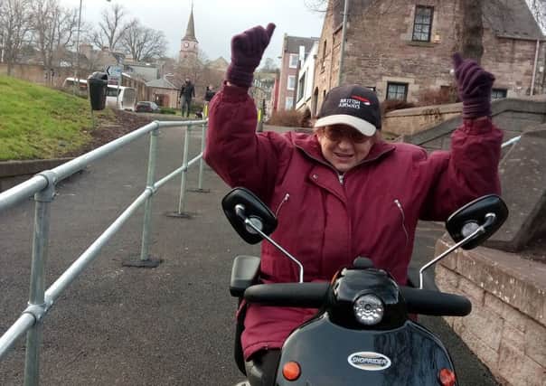 Jedburgh resident Iris Hutcheon shows her delight at being able to use the underpass into town after a six-year fight.