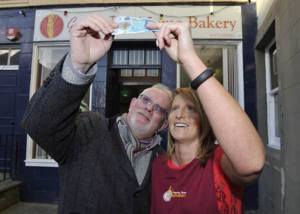 Tony Huggins-Haig and Patsy Johnstone (who took in the fiver from Tony earlier this month) outside Granny Jean's Bakery in Kelso.