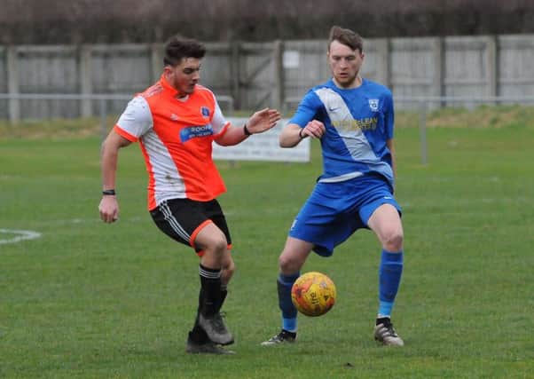 Phil Addison, in blue, was among those on target for Selkirk at home on Hogmanay against Vale of Leithen (picture by Grant Kinghorn)