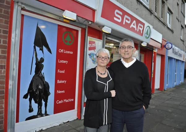Kathryn and George McCusker outside their Dickson Street Spar store.