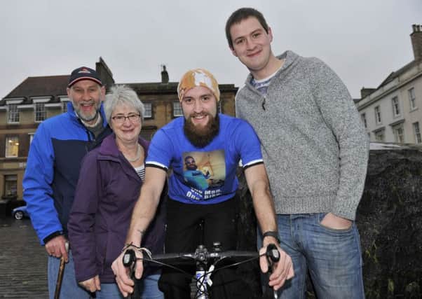 Jonny Wolf, centre, with mum Janet, dad Ken and brother Andrew.