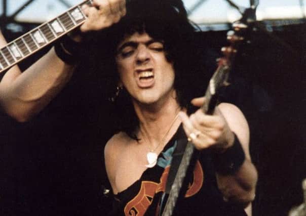 Jimmy Bain on stage with Dio.