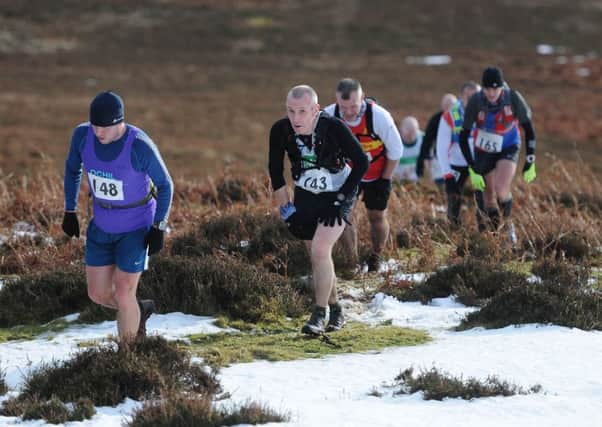 Runners ascend the Peat Law on the first hill climb of the Feel the Burns route (picture by Grant Kinghorn)