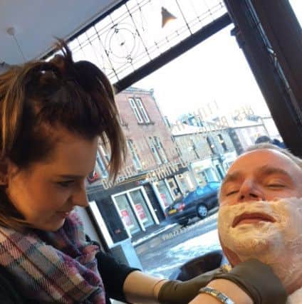 Rachel Casson makes use of her new skills at the Italian Job Barber shop