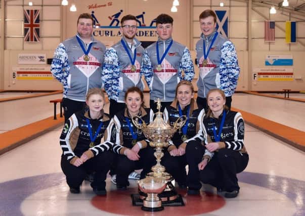 Cameron Bryce, pictured back left, with the men's and women's junior championship teams (photo by Brian Battensby).