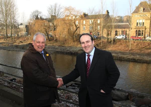 Councillor Gordon Edgar, left, Scottish Borders Council's Executive Member for Roads and Infrastructure, with MSP Paul Wheelhouse during an inspection of works alongside the River Teviot in Hawick.