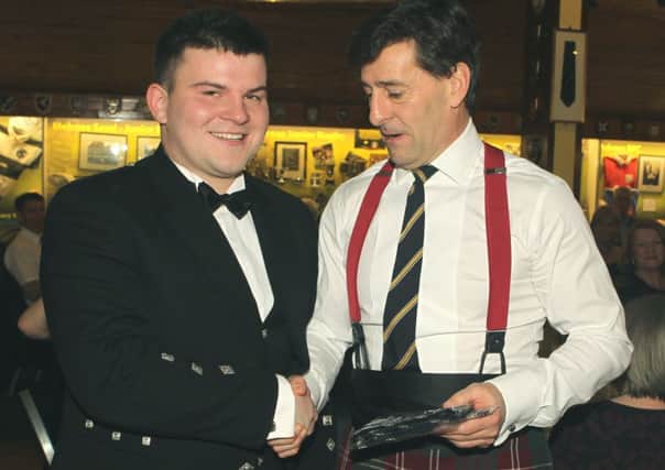 Festival chairman Michael Crawford presents Melrosian Elect Russell Mackay with his  tie.