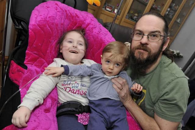 Brian Johnstone with daughter Rihanna and son Larsson at home in Galashiels.