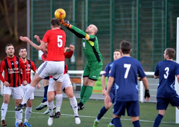 Dalbeattie 'keeper beats the Gala FR players to a high ball (picture by Alwyn Johnston)