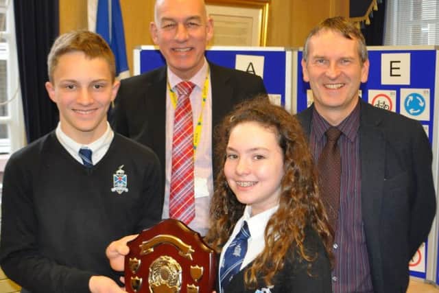 Scottish Borders Council infrastructure manager Colin Ovens and network manager Brian Young with Ross Lothian and Lucy Brennan of Hawick High School.