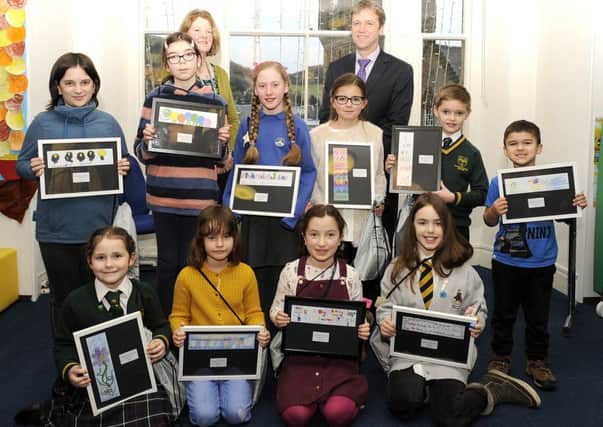 Pictured with Christine and Ewan, back, are, middle row, from left, Edith, Isla, Roberta, Charlotte, Finlay and Faizan, with, front, Nicole, Ella, Kitty and Ellie.