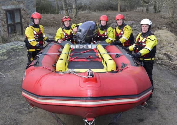 Hawick water rescue team members including watch manager Roddy McIntyre, far right, have welcomed the arrival of their new water rescue unit.