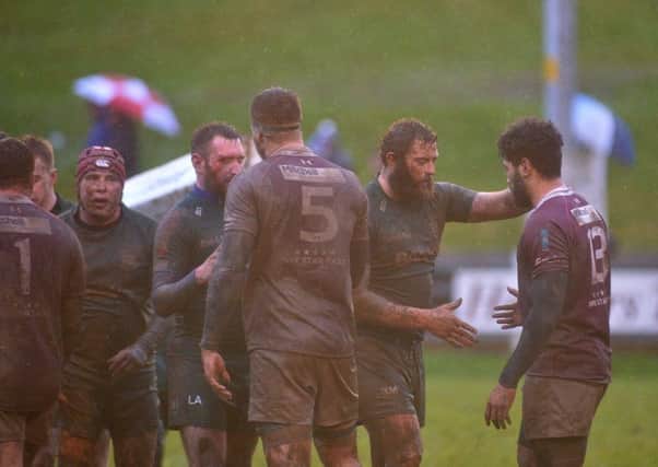 Hawick captain Bruce McNeil extends a handshake to Sasa Tofilau  at the end of the BT Premiership road for Gala (picture by Alwyn Johnston)