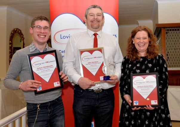 The Peter Norris Local Hero award winner, John Davidson, centre, with runners-up Callum MacDonald and Vanessa Richardson.