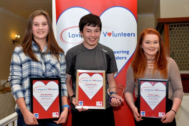 Young volunteer of the year Hamish Swan, centre, with runners-up Kira Renilson and Chloe Logan.