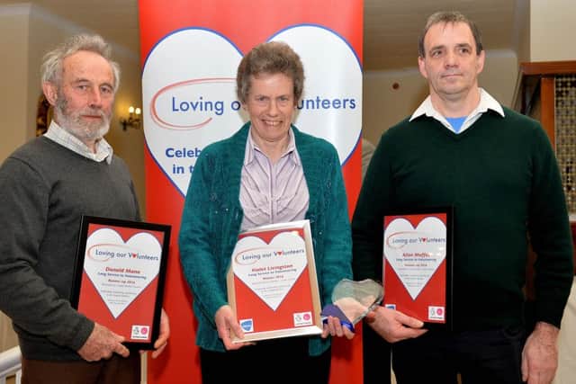Long Service award winner Violet Livingston, with runners-up Donald Mann and Allan Moffat.