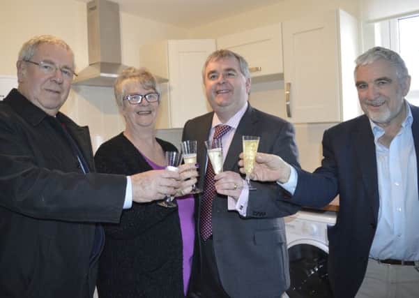 Councillors Graham Garvie, Frances Renton, David Parker and Stuart Bell toast the new affordable homes in Innerleithen