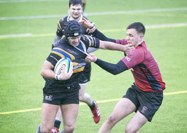 Hawick's Ross Nichol, in headguard, scored a hat-trick of tries for the Quins (picture by Bill McBurnie)