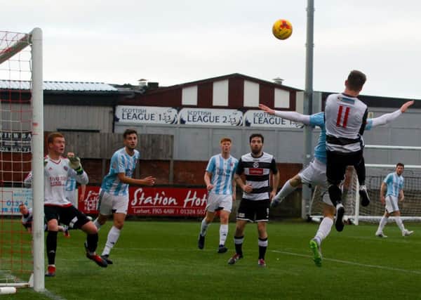 Busy action in the box between East Stirlinghsire and Gala Fairydean Rovers, in blue and white (picture by Scott Louden)