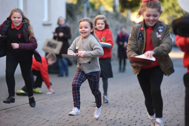 Pancake race on Shrove Tuesday up Murray Street in Duns.