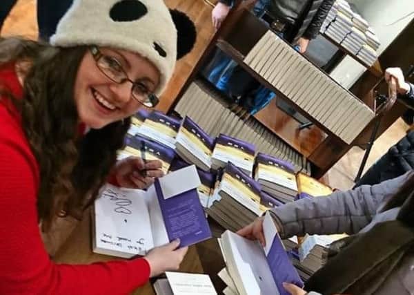 Claire McFall at a book signing in China.