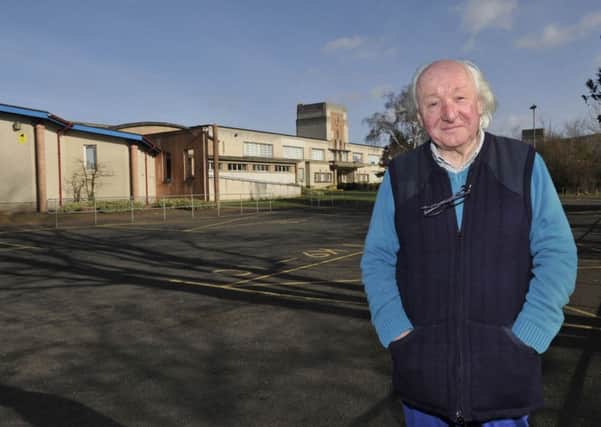 Colin McGrath outside Kelso High School where he proposes that the school be made into a village for older people when it is left empty later this year.