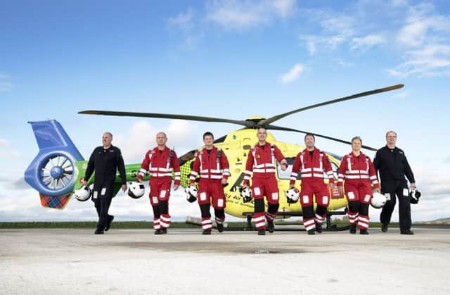 Scotland's charity air ambulance (SCAA) team pictured from left: Captain Nigel Clarke, paramedic John Salmond, paramedic Graeme Hay, lead paramedic John Pritchard, paramedic Craig McDonald, paramedic Julia Barnes and captain Russell Myles. Pic: Graeme Hart/Perthshire Picture Agency.