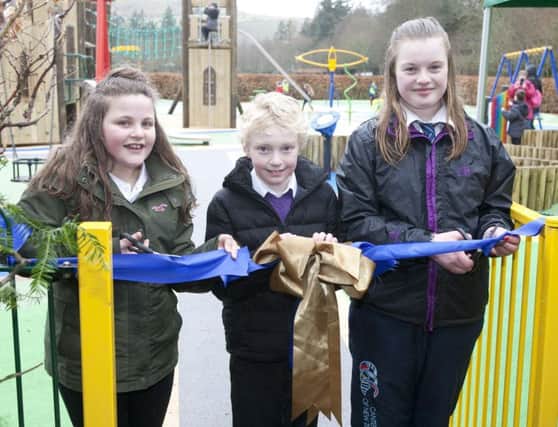Primary school children, Jessica Scott, Ryan Cox and Ruathy Brogan opening the new payground at Wilton Park.