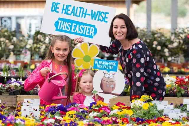 Pharmacist Hazel Close with Rianna Baillie (10) and Aylee Frazer (5) helping launch the "Be Healthwise this Easter" campaign for NHS24 at Dobbies Garden Centre, Dunfermline.