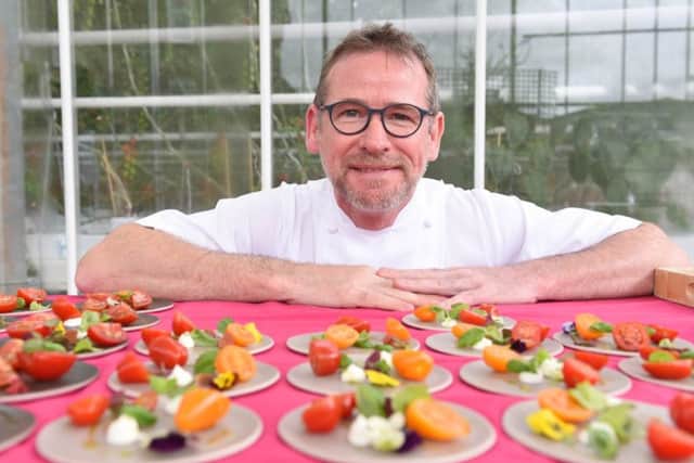 Chef Andrew Fairlie visits Standhill Farm near Hawick this morning. Andrew was taken on a tour around the large greenhouse which grows tomatoes for Scotty Brand food products. Seen here with a salad Andrew has prepared using Scotty Brand tomatoes.