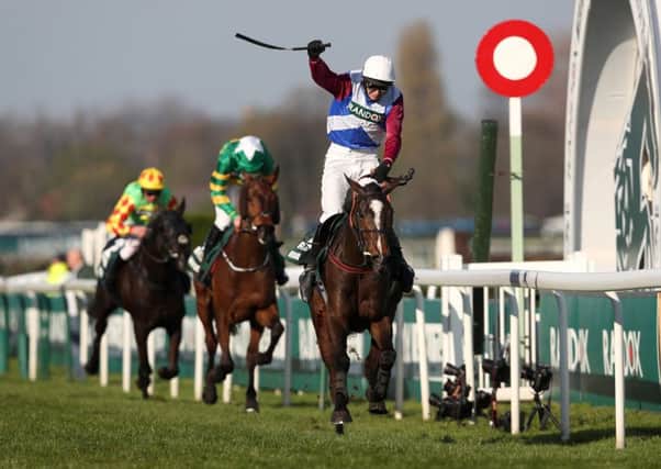 One For Arthur, ridden by Derek Fox, crosses the line to win the Randox Health Grand National at Aintree Racecourse.