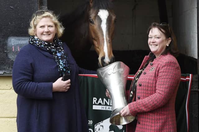 Grand National winner One For Arthur's owners Belinda McClung, left, and Debs Thomson with him at Lucinda Russell's yard near Kinross today.
