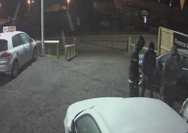 The three hooded raiders captured on CCTV.
